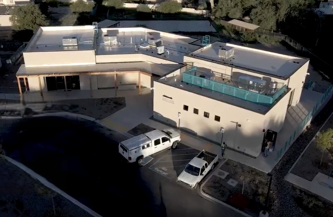 Ribbon cutting at Abedon Lopez Sr. Senior Center with community members and officials.