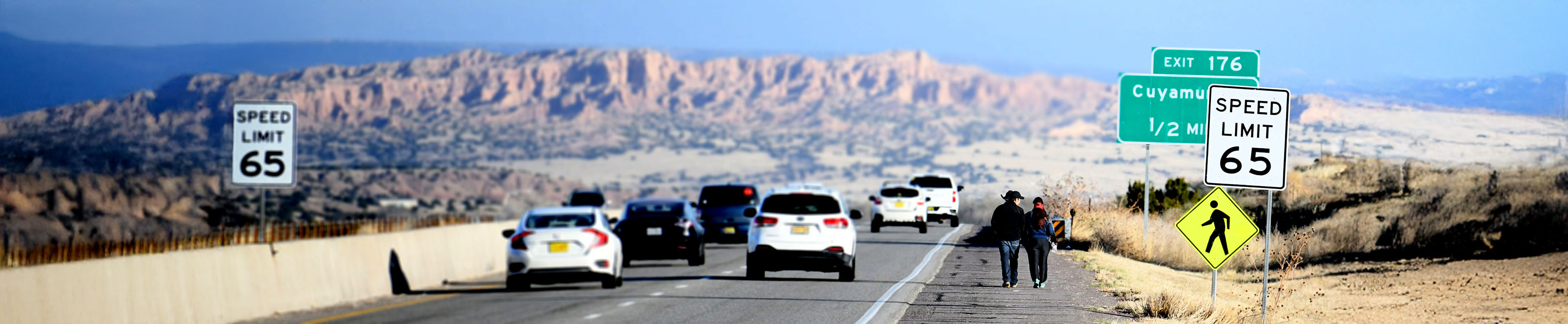 Pilgrims walking toward Santuario de Chimayó
